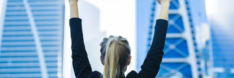 Woman winning, fot. ShutterStock