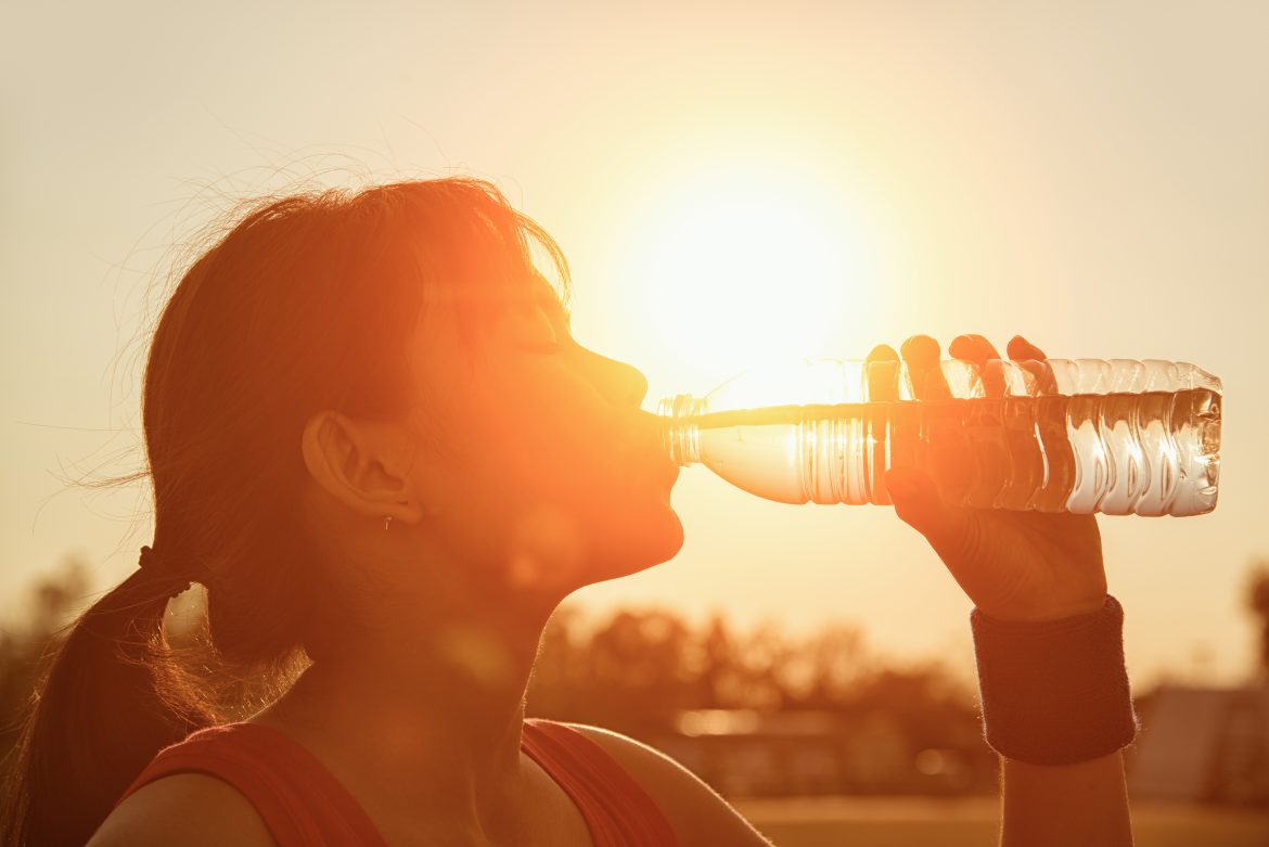 Female,Drinking,A,Bottle,Of,Water.